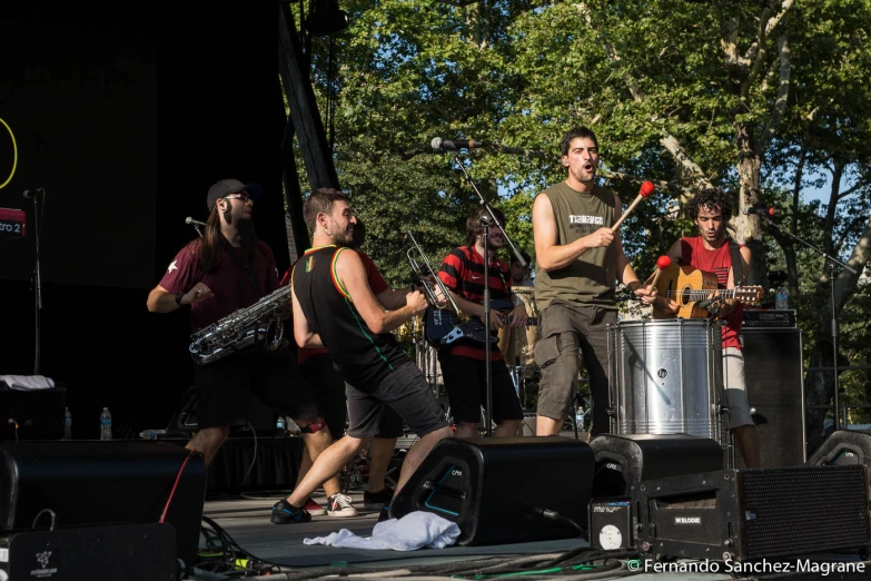 a band playing on stage with musical equipment