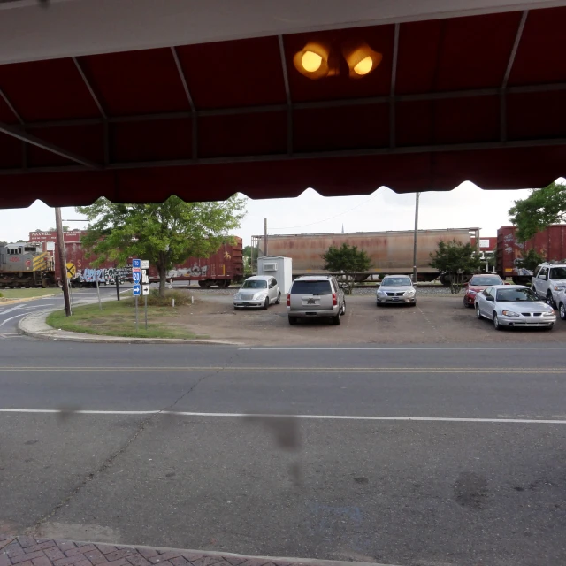 several vehicles parked next to each other in front of a store