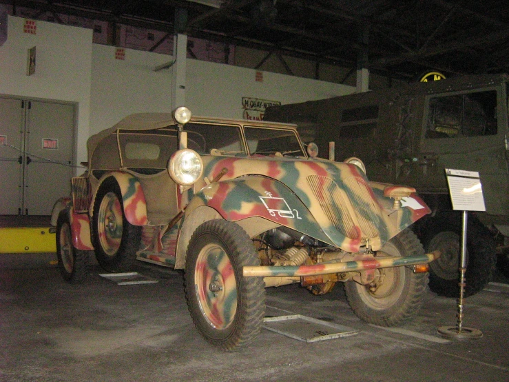 an old military vehicle is displayed in the garage