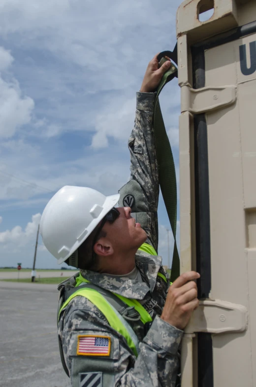 an employee uses the control tower in a factory