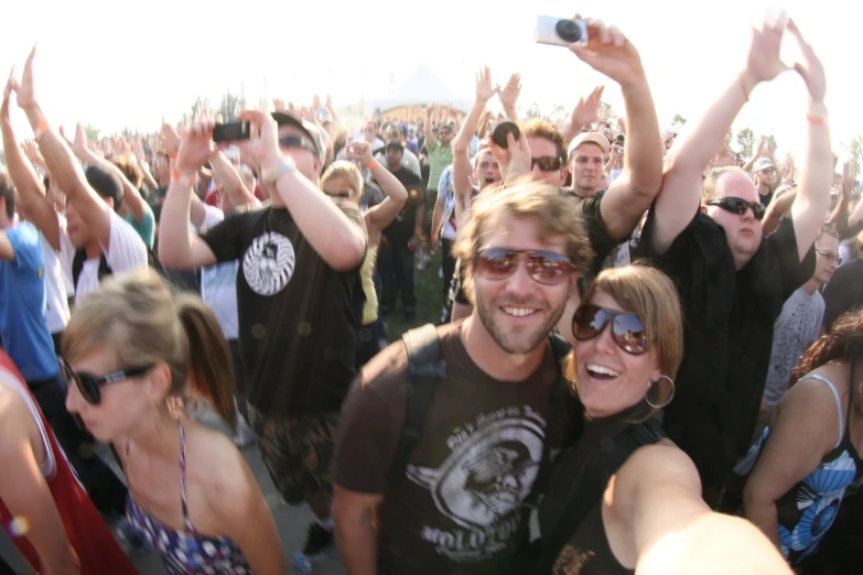 a crowd of people are outside at an outdoor event