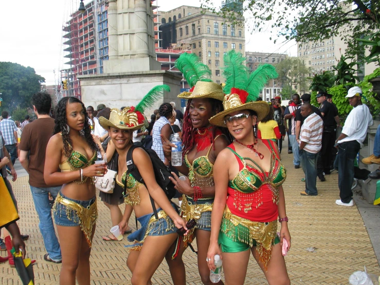 several people in costumes standing on the street