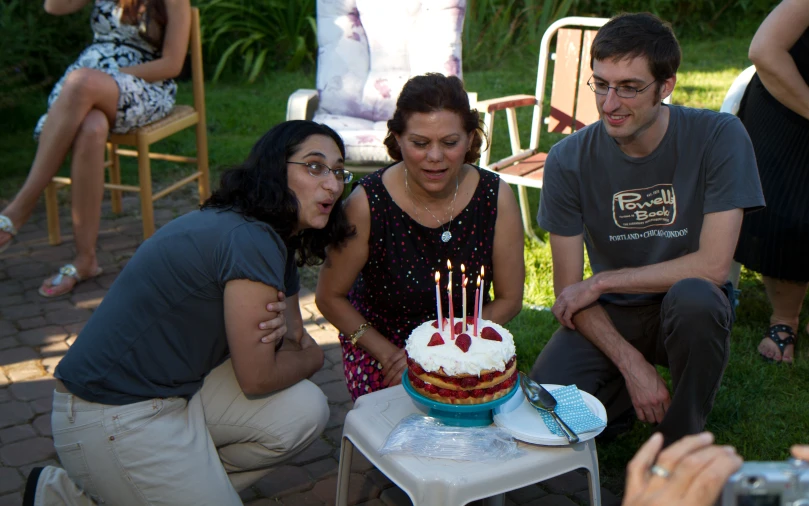 a man and woman at a party celeting her birthday