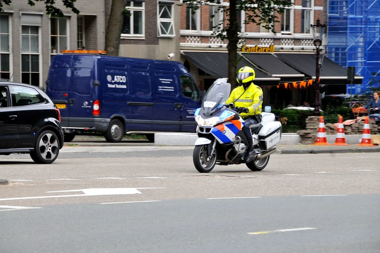 a person is riding a motorcycle on the street