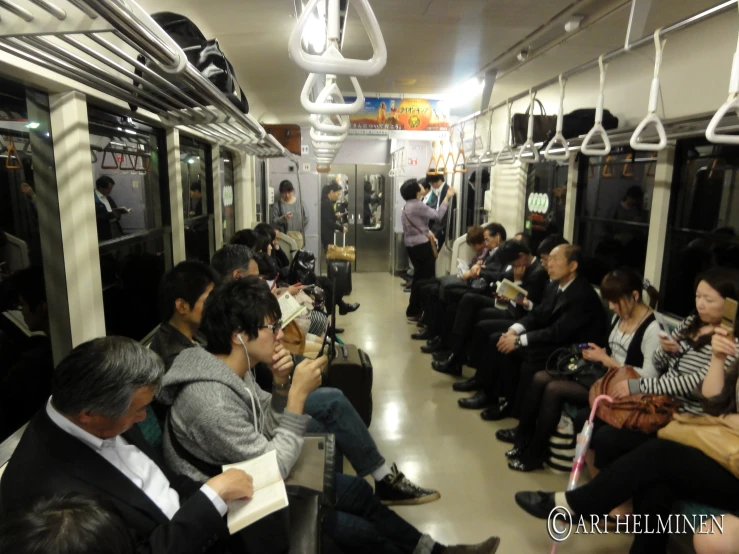 a group of people that are sitting on a train