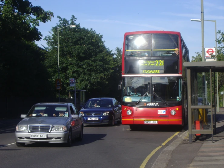 two double decker buses driving down the street