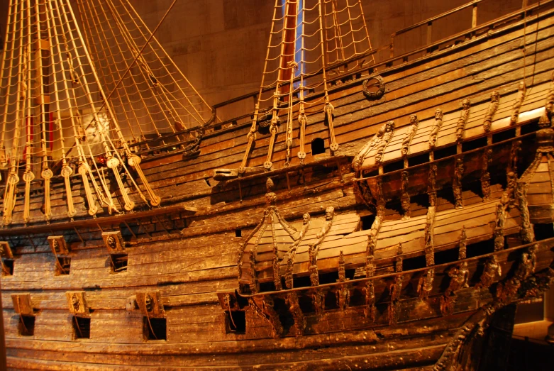 an old wooden model of a sailing ship