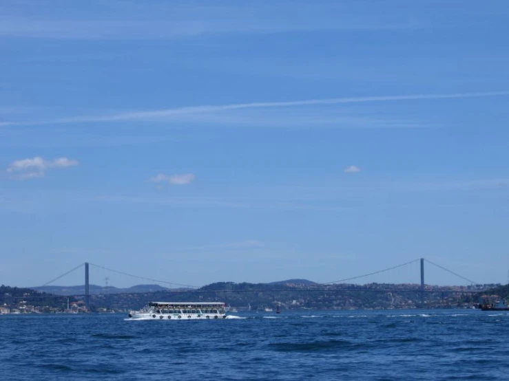 a ferry that is passing by another boat