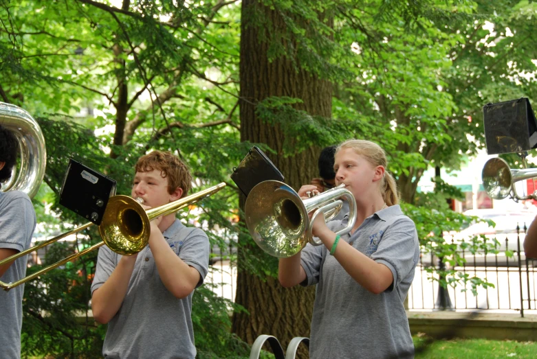 a boy and girl playing different types of musical instruments