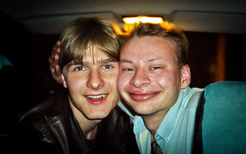 two people smiling while posing for a picture