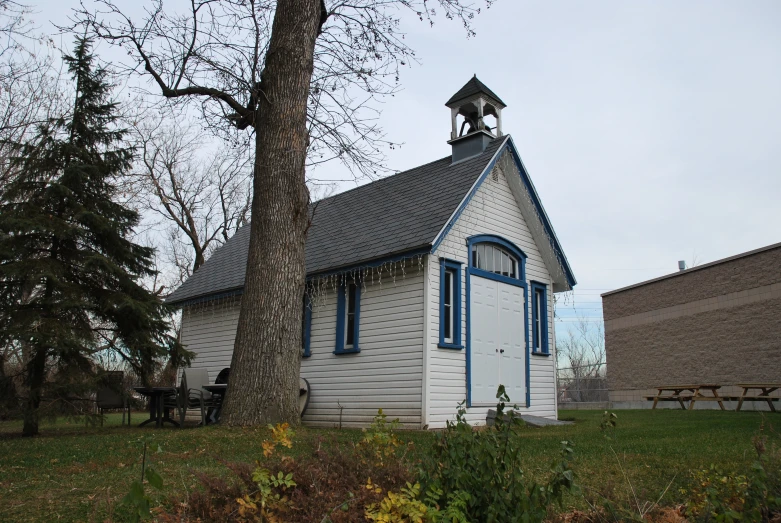 this is a small white church with a tower