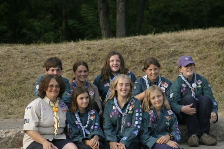 a group of girls and boys sitting together