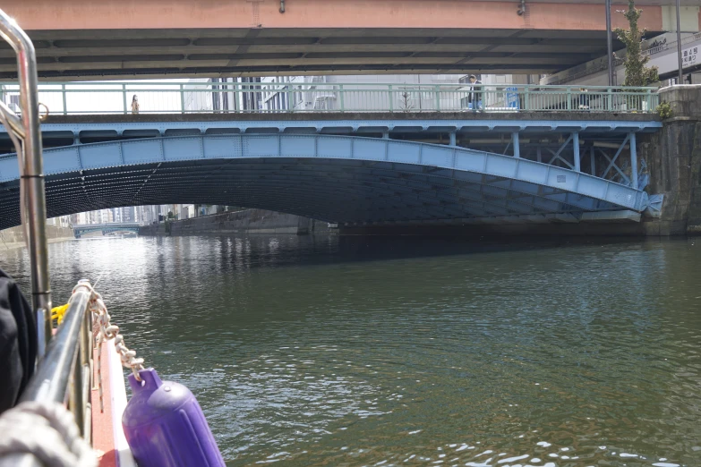 the bridge is crossing over the water from a boat