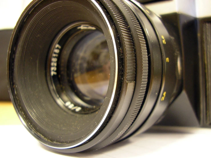 the camera lens of a large digital slr camera