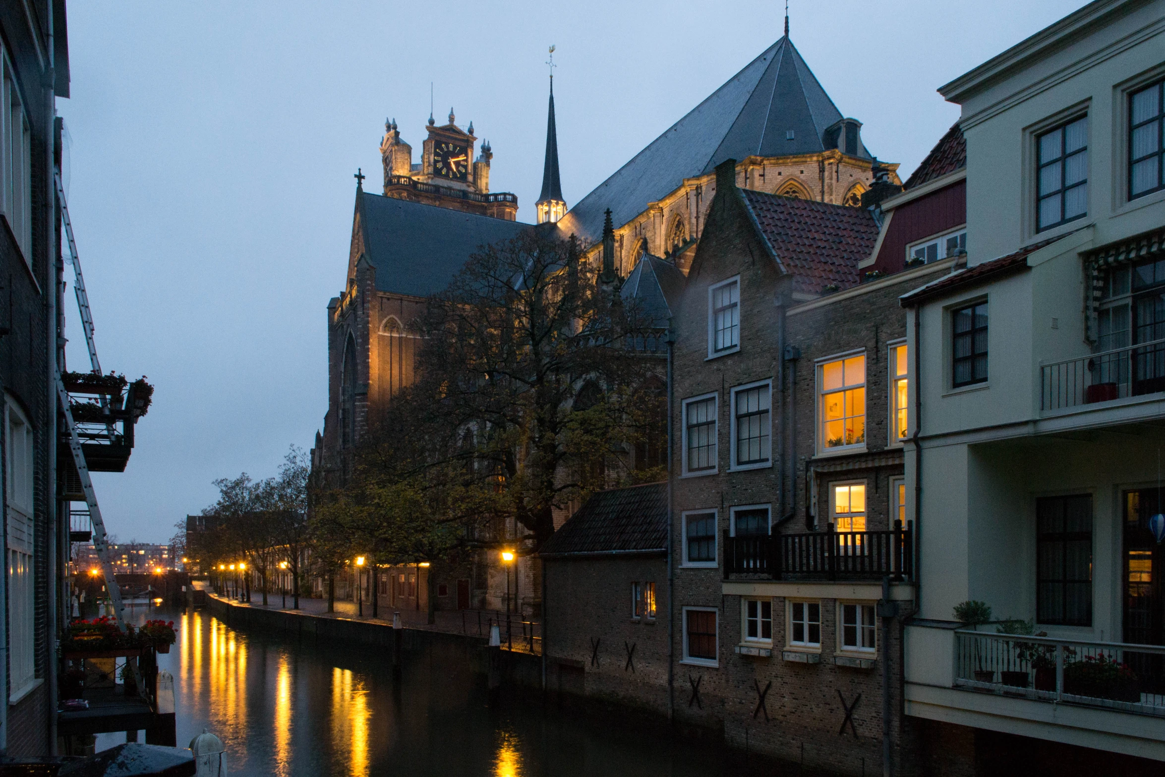 a canal running through a small town at night