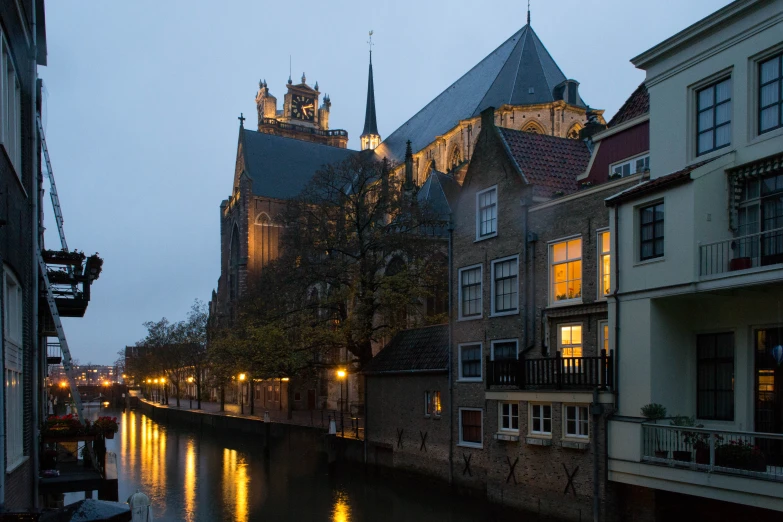 a canal running through a small town at night