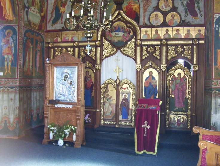 a small shrine with religious paintings on it