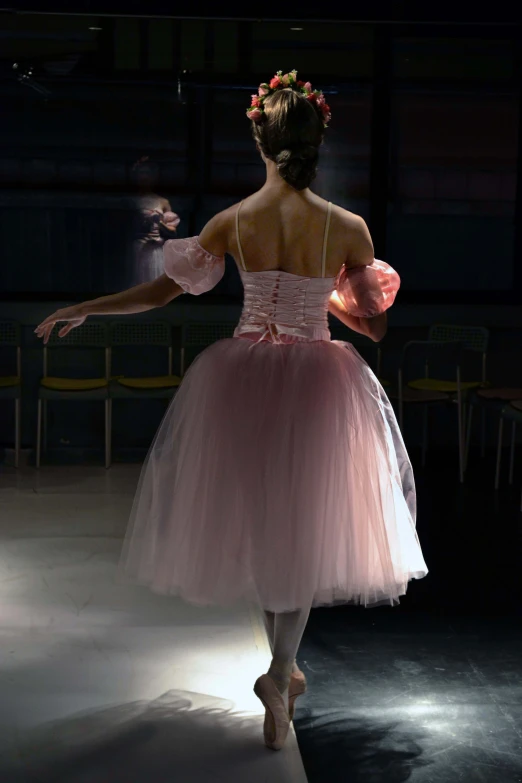 a woman in a dress dancing with a ballerina