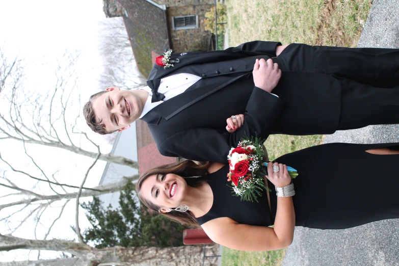 a young man and woman posing for the camera