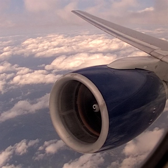 view from an airplane over a vast blue ocean