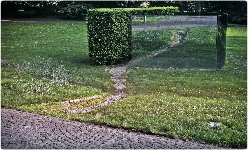 a sculpture that is near the side of the road