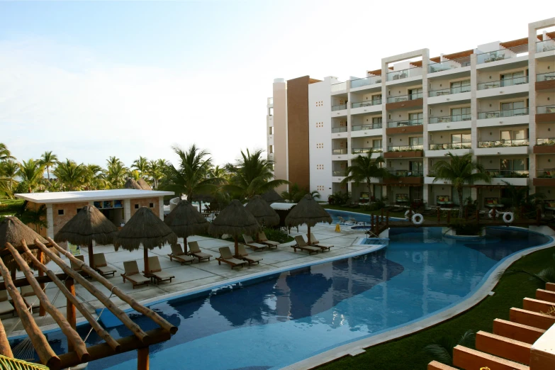 an outdoor pool near the entrance to an apartment building