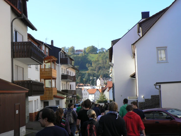 a bunch of people that are walking in a street