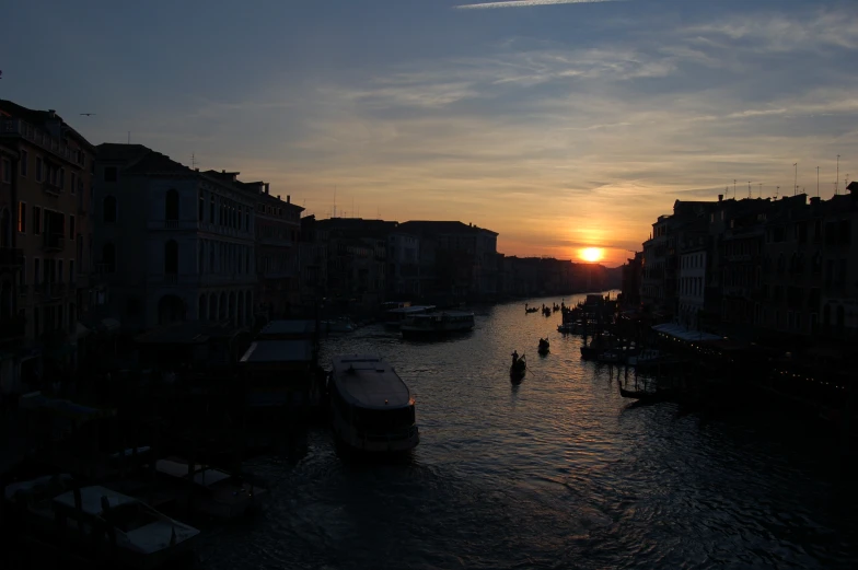 boats on water at sunset in the city