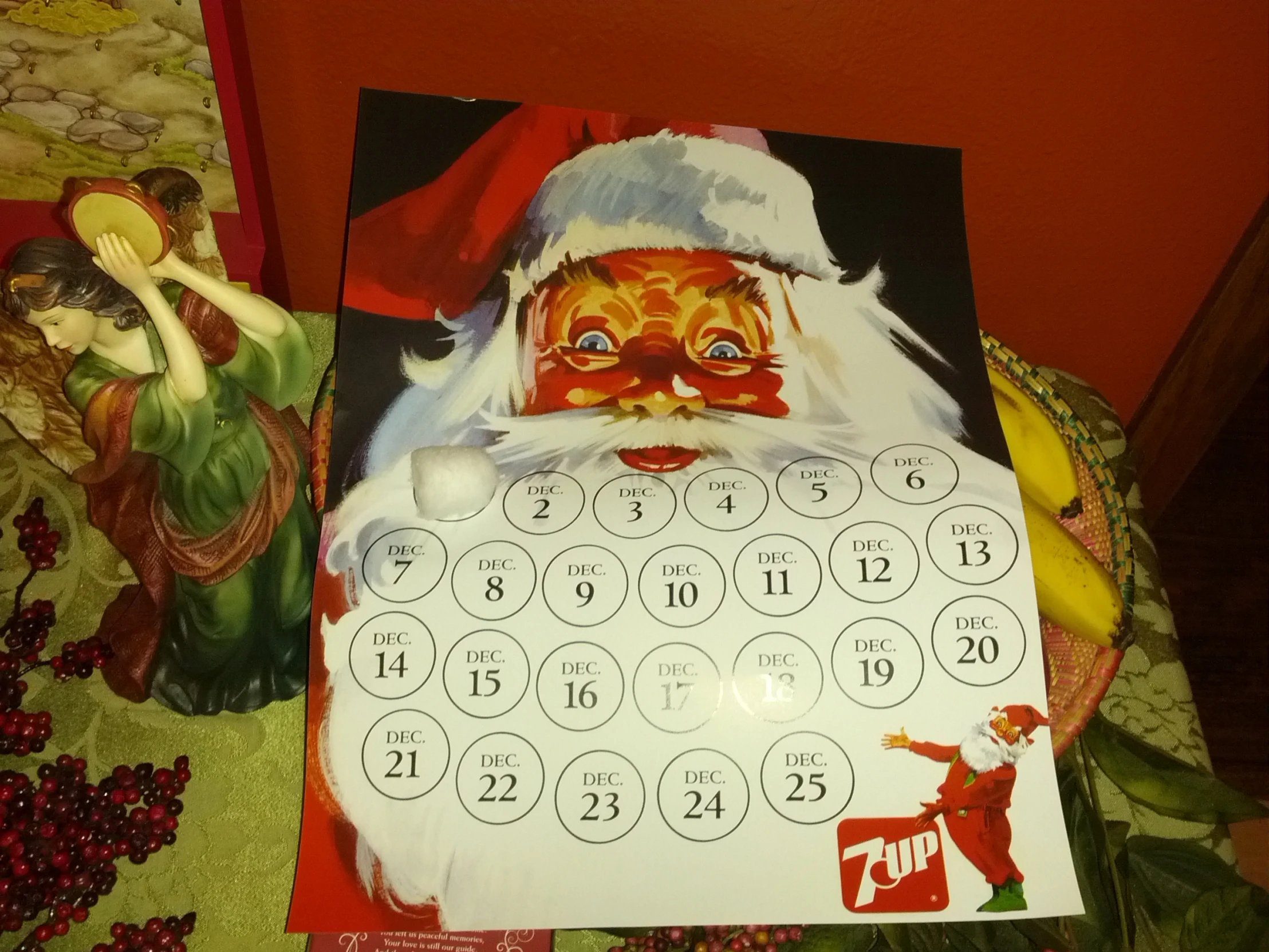 santa claus is on top of a holiday themed calendar
