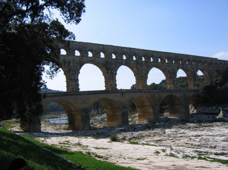 an old and dilapidated bridge with pillars on it