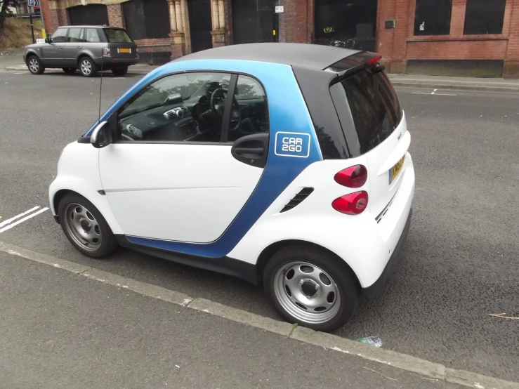 a smart car is parked on a parking lot