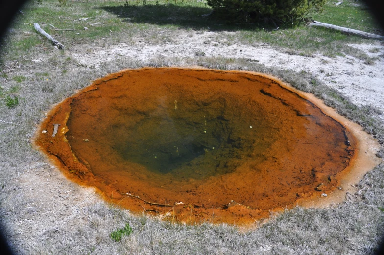 a dirt area with lots of water inside of it