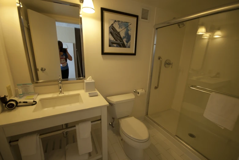 bathroom with large shower and sink next to toilet