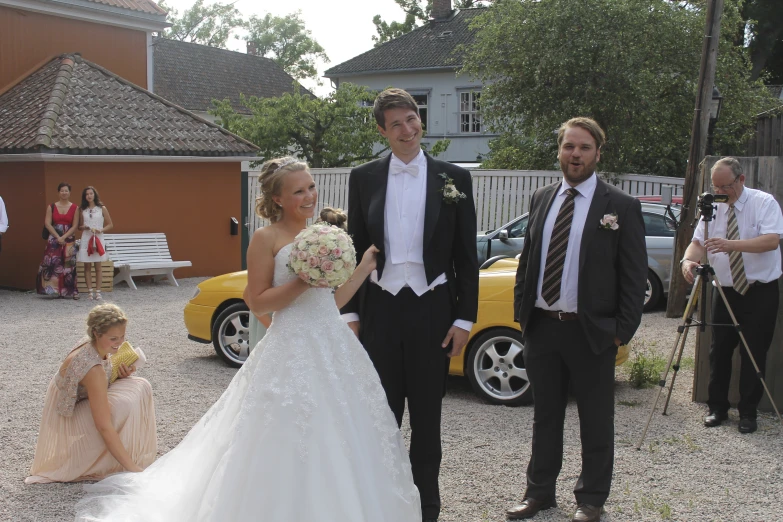 a man and woman with a flower girl