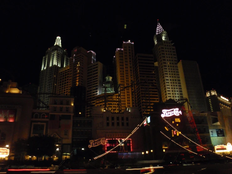 a night time picture with lights and city buildings