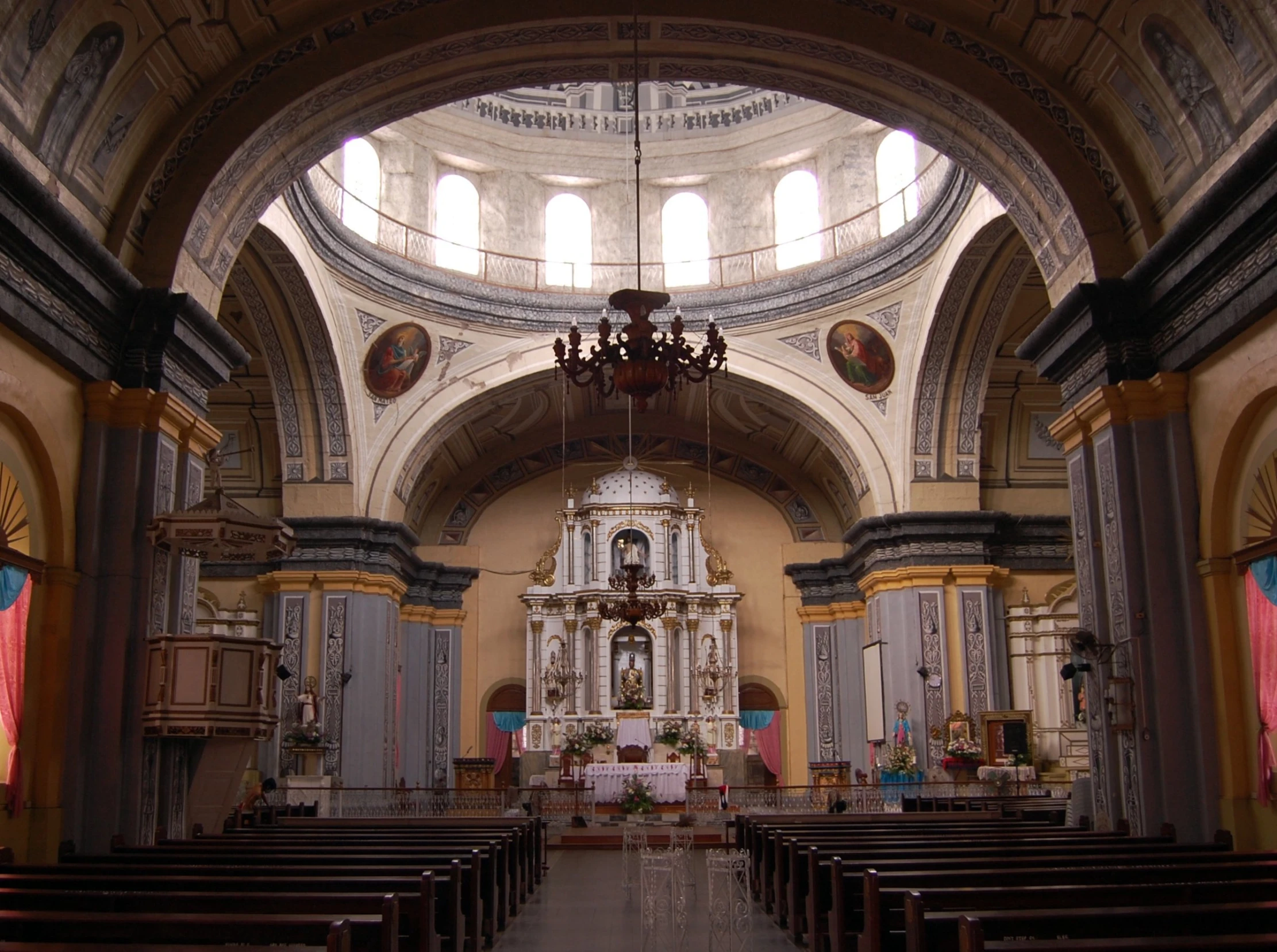 the inside of an old church with rows of pews