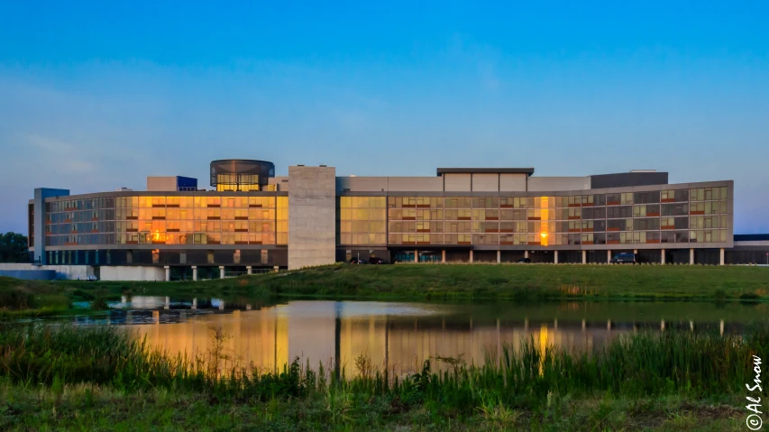 a el building in front of water on a clear day