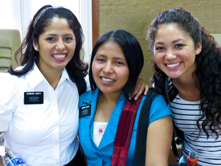 three female travelers pose for a picture together