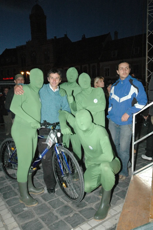 people are dressed in costumes while standing with their bikes