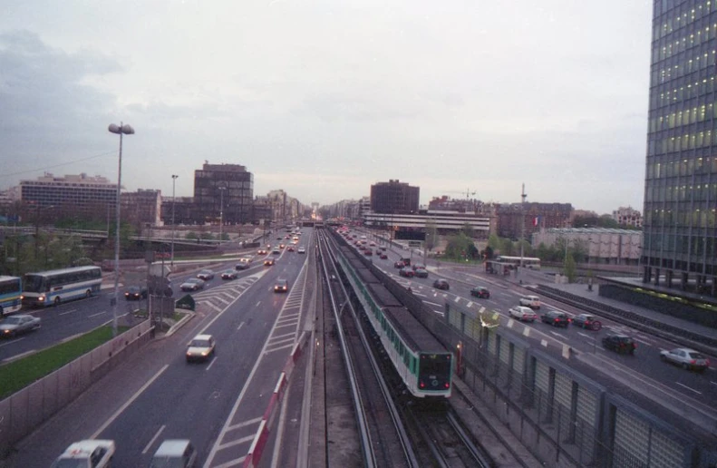 a busy road with cars and buildings along it