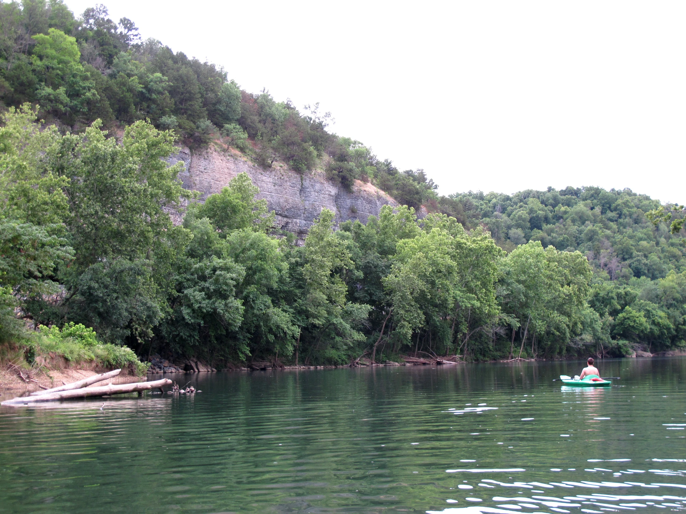 two canoes in the water going down the river