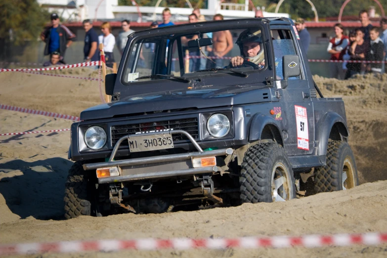 a truck that is driving in the dirt