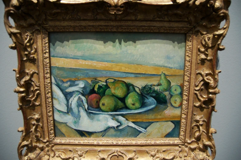 painting with yellow framed around the image in gold frame