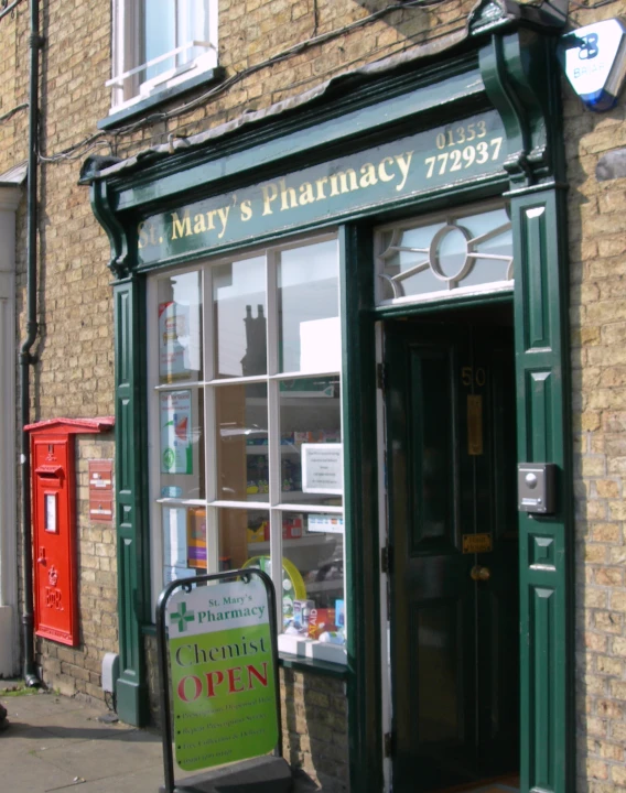 a store is open on the side of the street