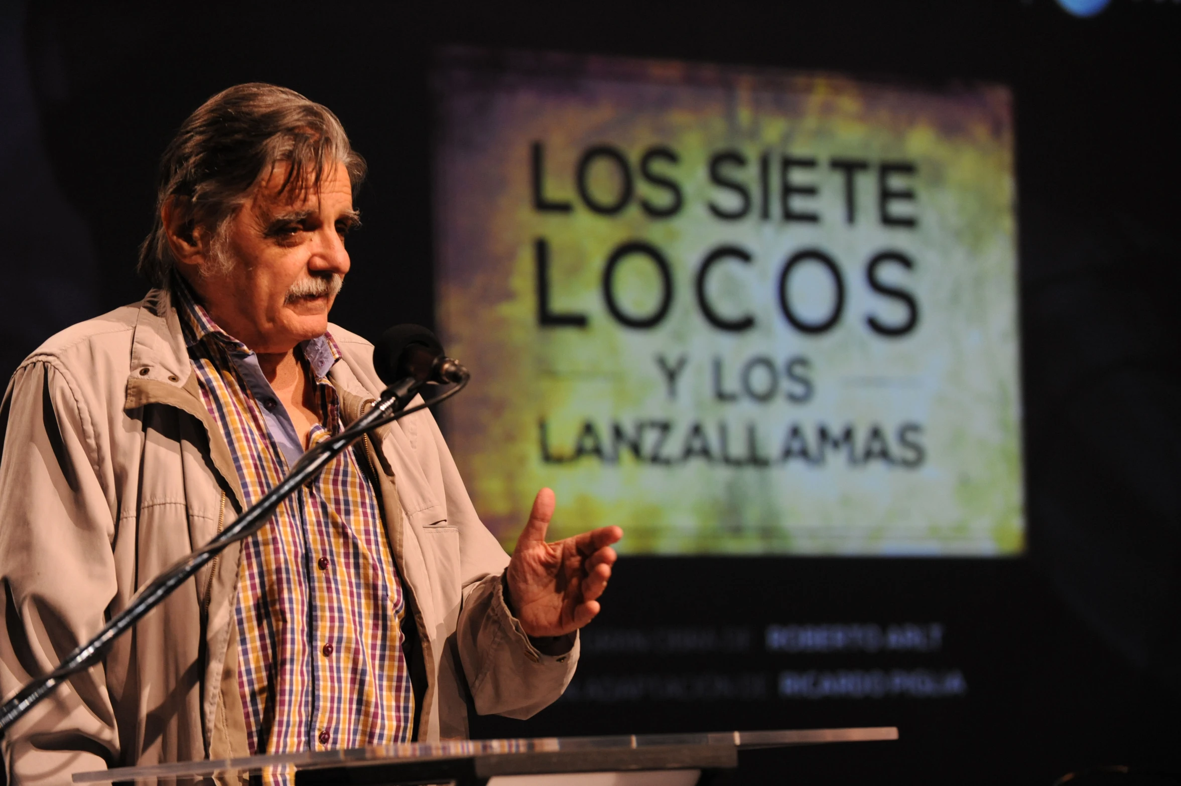 a man giving a presentation at a podium