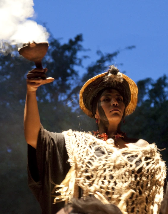 a woman in a costume holding a bowl of food