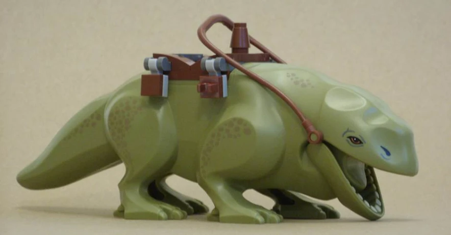 the small green dinosaur with the horse is carrying it's carriage