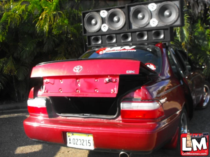 the trunk of a car with speakers and a speaker in it