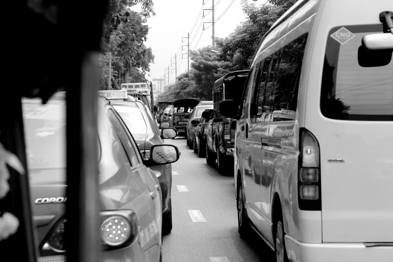 cars are parked along a street that is very busy