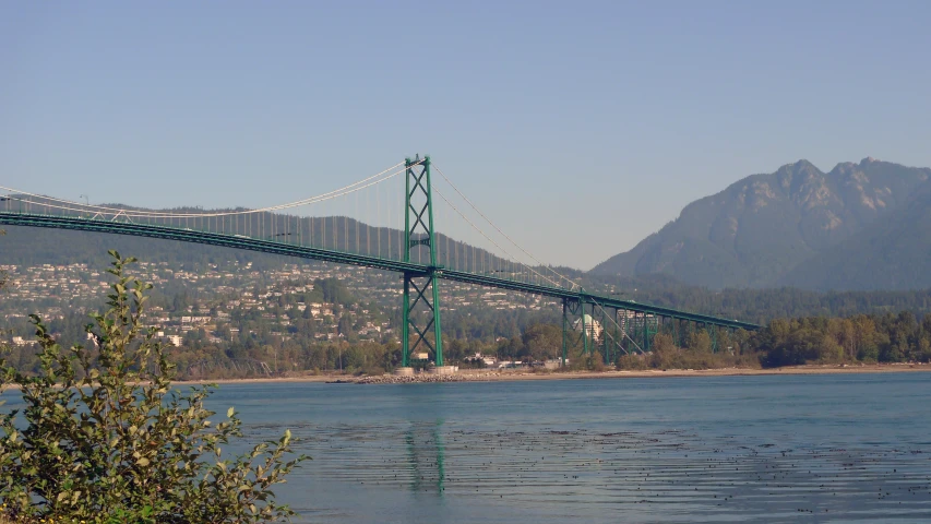 a long bridge is spanning across the water